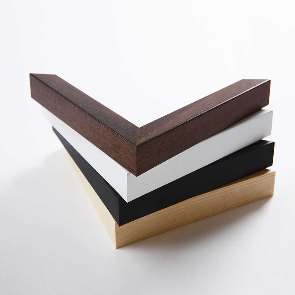 Wooden corner trim in four colors on a white background
